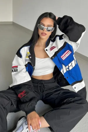 Black Air Jacket with blue and white panels worn by model