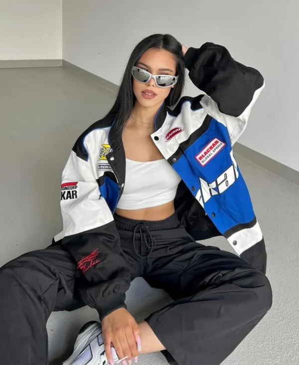 Black Air Jacket with blue and white panels worn by model