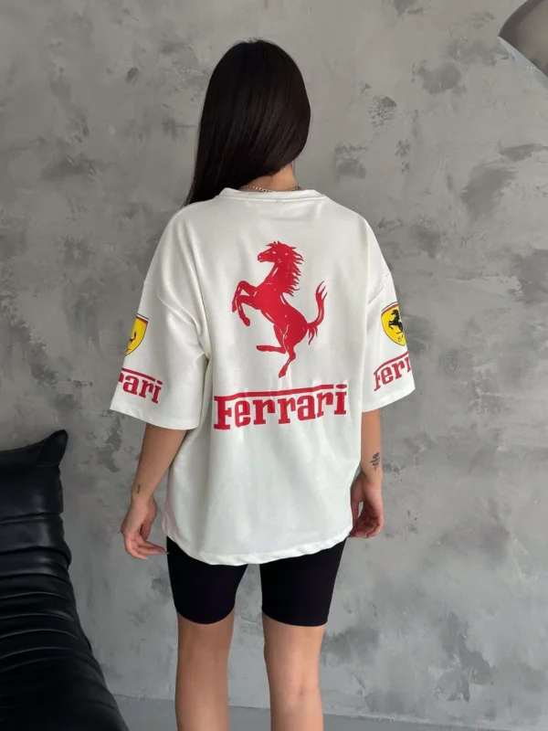 Woman in white Ferrari T-shirt with F1 sponsor patches
