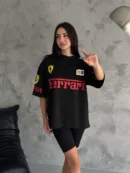 Woman wearing black oversized Ferrari T-shirt front view
