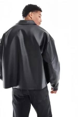 DRIP MANIA Black Leather Jacket rear view, highlighting the drop-shoulder and relaxed volume.