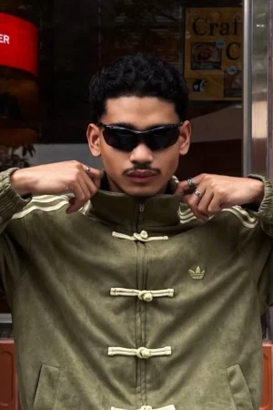 Close-up of the intricate Lunar New Year inspired embroidery on the Drip Mania Olive Green Jacket.