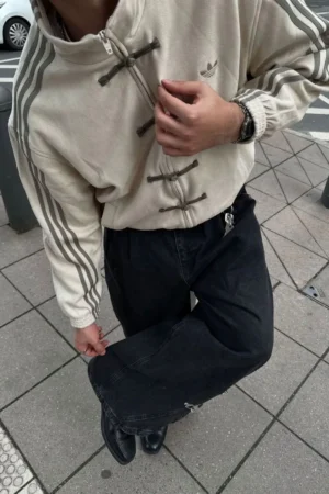 Side view of Cream CNY Jacket showing the premium fit and sleeve design