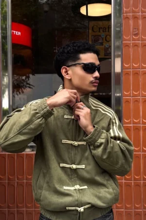 Front view of the Olive Green Chinese New Year Jacket by Drip Mania with premium embroidery.