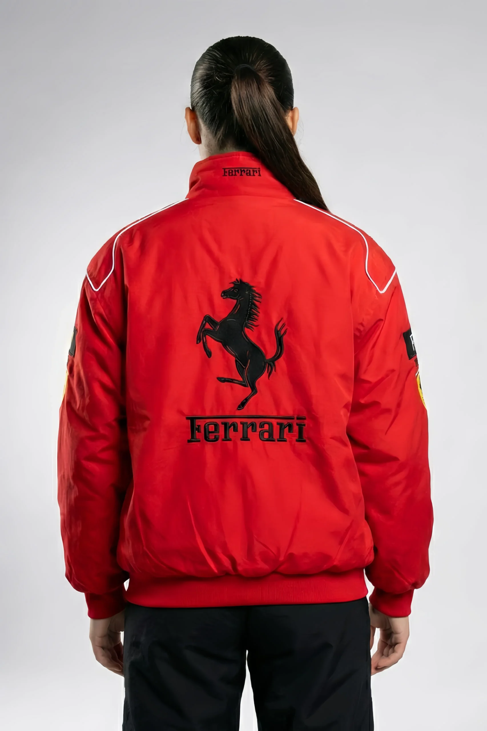 Detailed back view of the Red Ferrari Jacket Embroidered with large-scale vintage Ferrari style branding. A high-octane statement piece designed as a unisex F1 racing jacket for the ultimate drip by DRIP MANIA.
